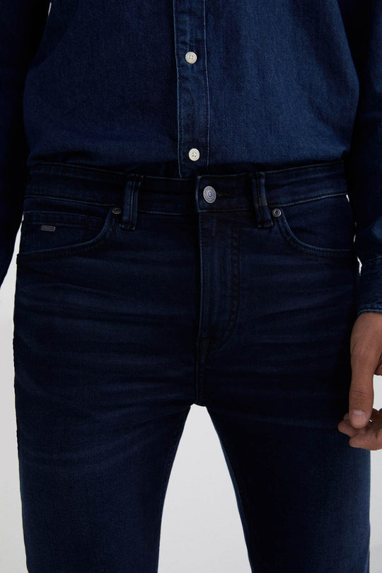 Washed dark blue slim fit jeans