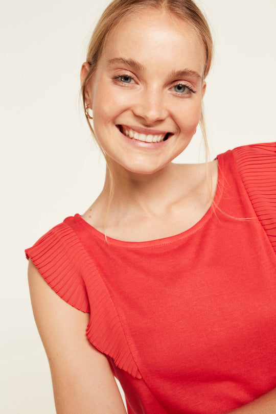 Pleated flounced blouse